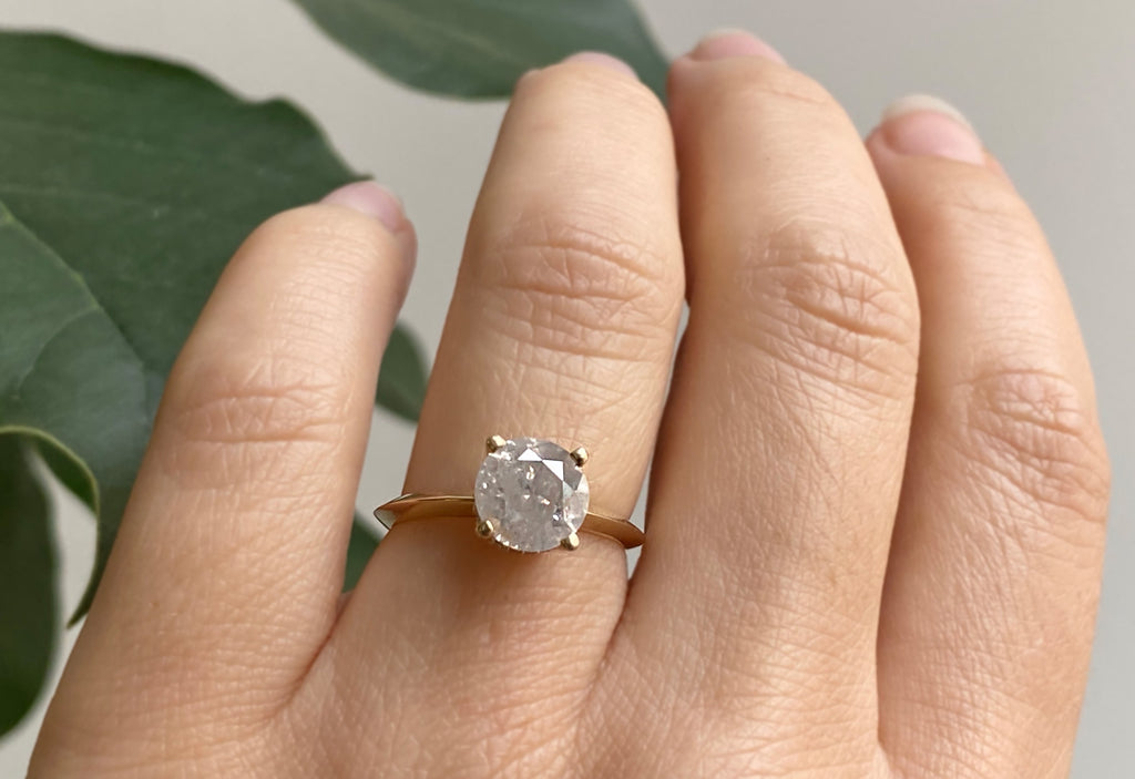 The Iris Ring with an Opalescent Round Diamond