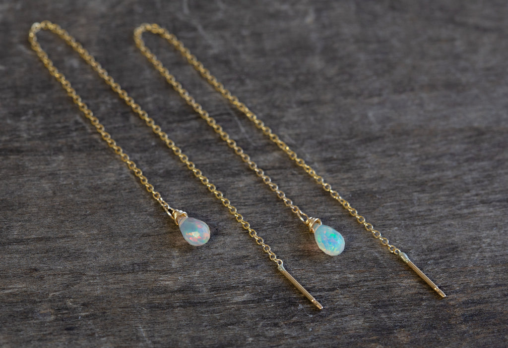 yellow gold Natural Opal Thread Earrings on wood table