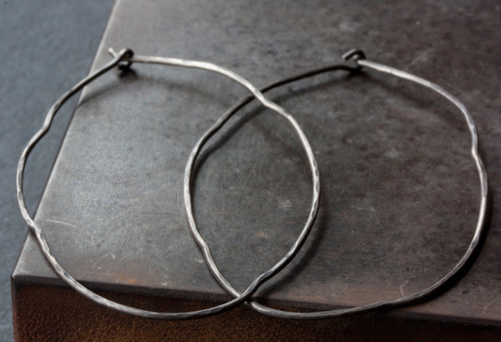 Organic Hoop Earrings on a brown square tile