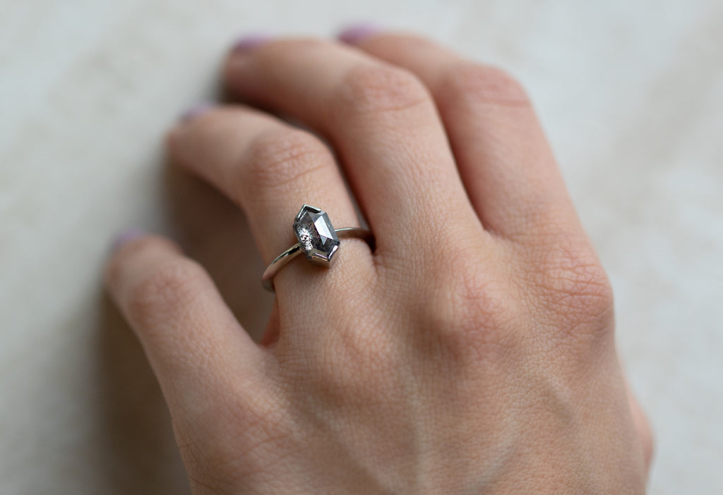The Sage Ring with a Salt + Pepper Hexagon Diamond on Model