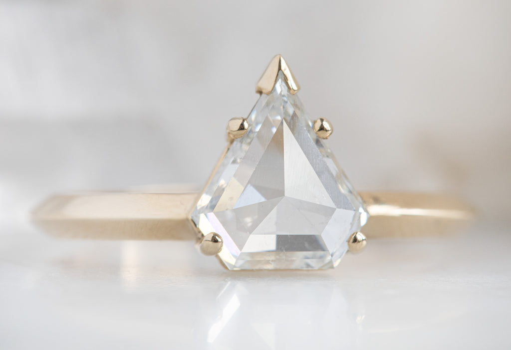 The Sage Ring with a White Shield Cut Diamond