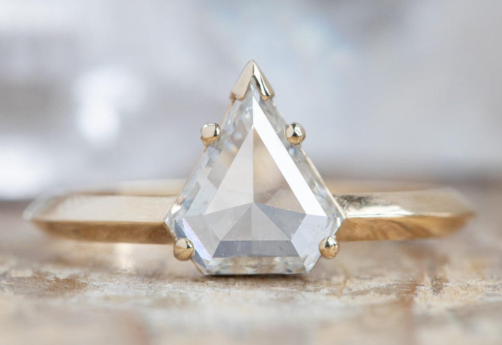 The Sage Ring with a White Shield Cut Diamond