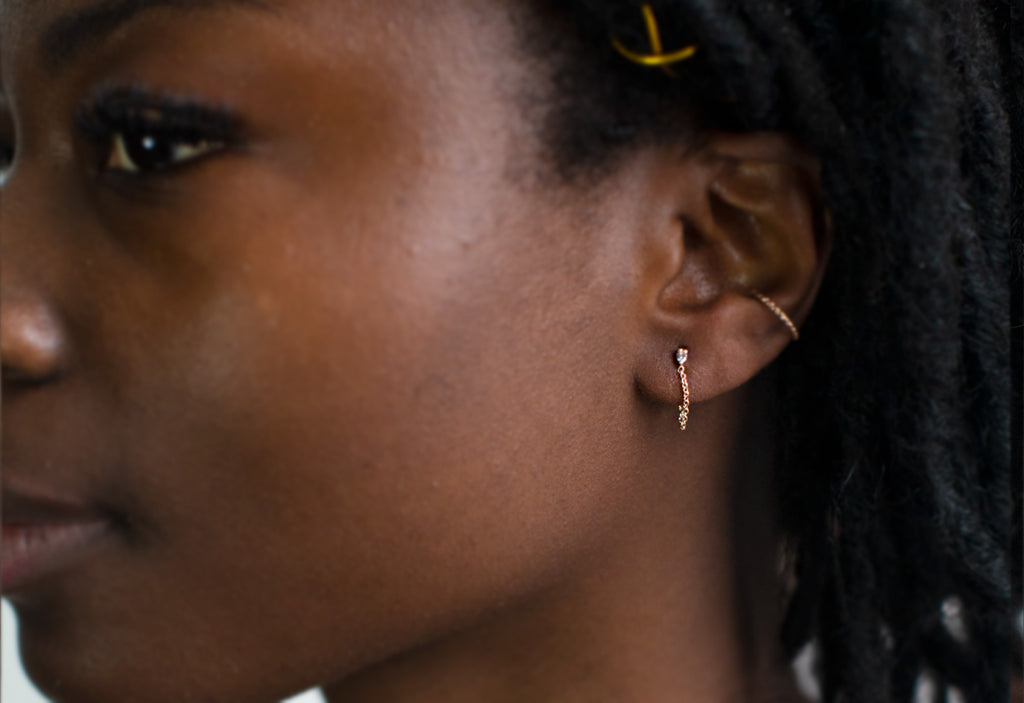 Diamond Sunburst Chain Earrings Stacked on Model