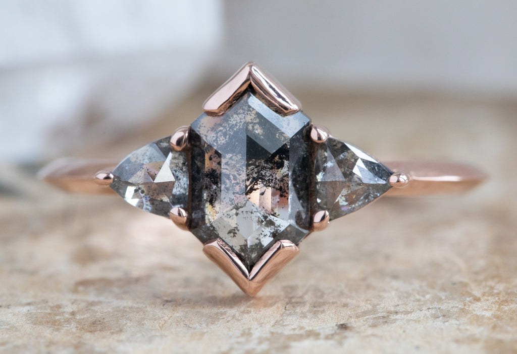 The Jade Ring with a Salt and Pepper Hexagon Diamond on Wood Table